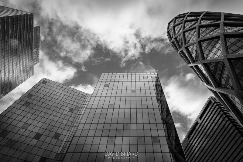 Low-Angle View of Glass and Steel Towers in La Défense Business District © David Briard