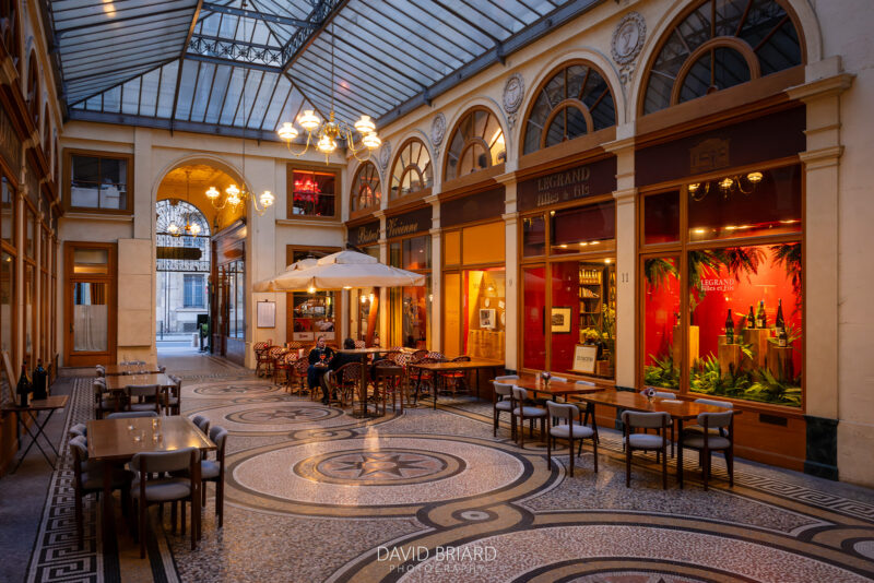 The Galerie Vivienne in the 2nd arrondissement features classic mosaic flooring, arched windows, and a glass roof.